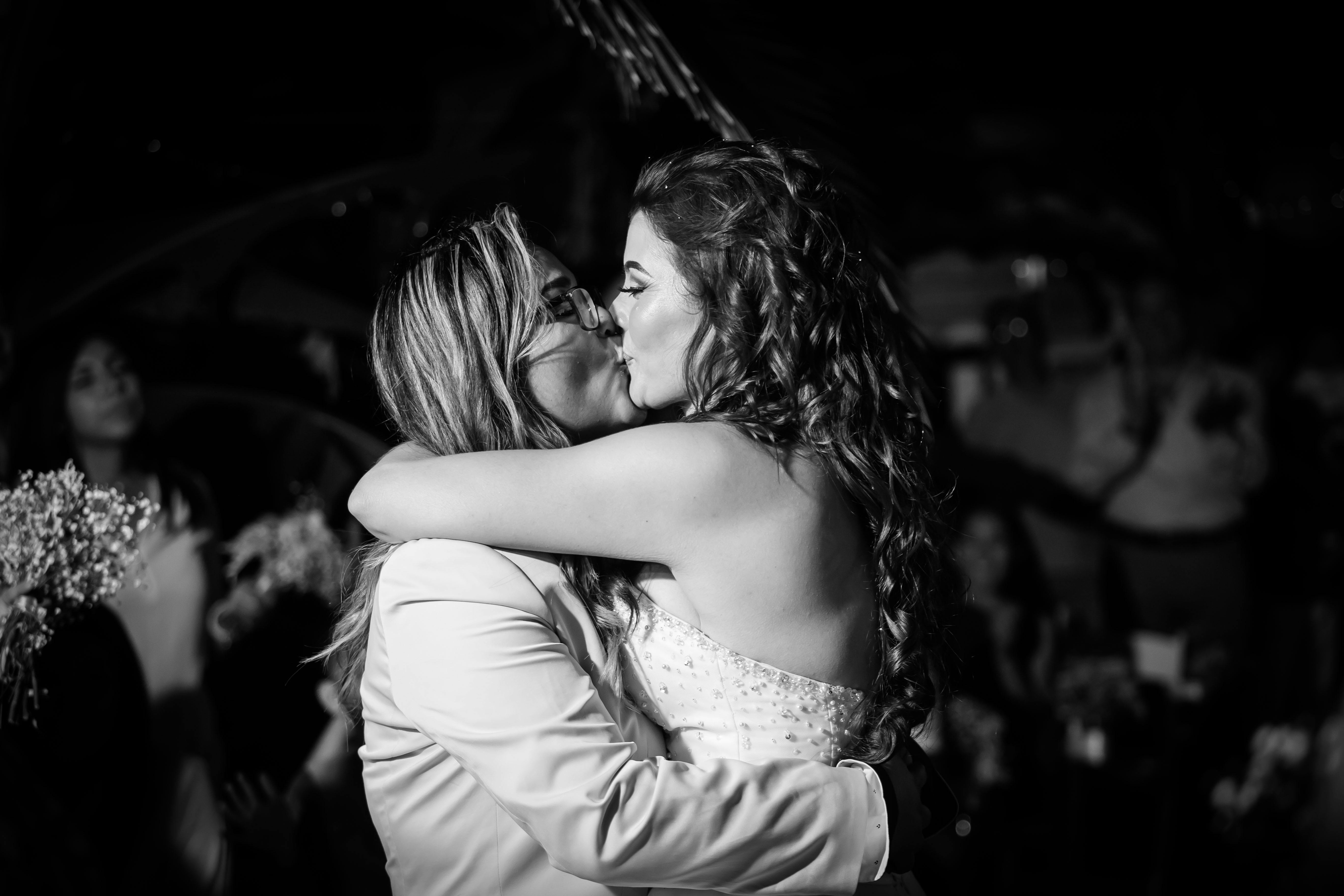 Two women kissing at their wedding